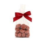 Maliny liofilizowane w czekoladzie mlecznej pudrowane maliną