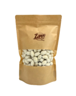 Migdaly w czekoladzie bialej o smaku kokosowym z wiorkami kokosa