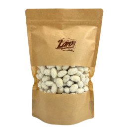 Migdaly w czekoladzie bialej o smaku kokosowym z wiorkami kokosa